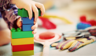 child playing with building blocks